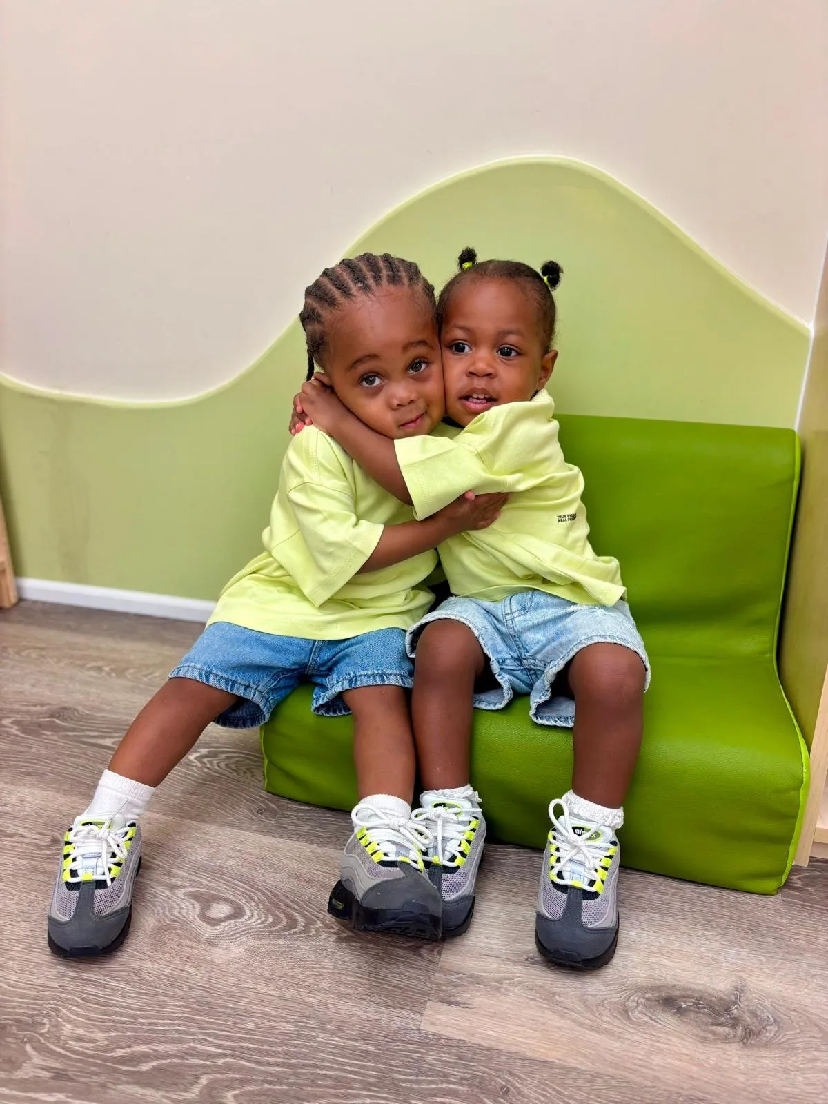 Two young friends hugging